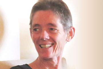 A profile style picture of Jacqueline Gamble, the author, smiling